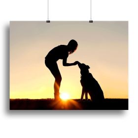 A silhouette of a girl sitting outside in the grass with her pet German Shepherd Mix Dog feeding him treats during training in front of a sunsett (Type: Poster Print, size: 28" x 20" / 70cm x 50cm (approx))